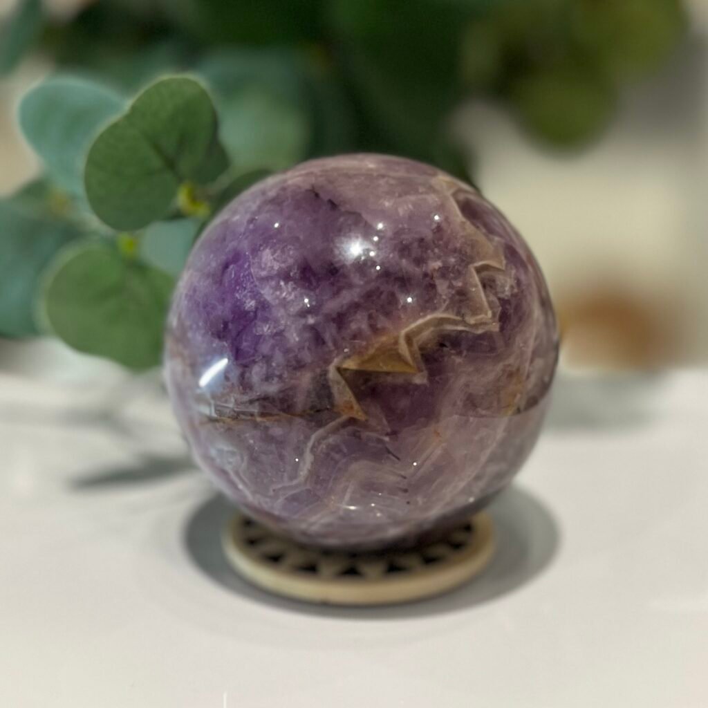 Amethyst sphere with white chevron banding, 73mm 489g, purple amethyst with a red jasper band, Mystic Grove UK