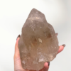 2-natural-smoky-quartz-point-1 Discover the grounding energy of this beautiful 1467g Himalayan Smoky Quartz Freeform. A powerful stone for protection emotional release and deep clarity.