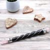 Direct Beltane love energy with this twisted silver healing wand topped with a Rose Quartz sphere. For ritual, aura cleansing, and altar display.