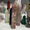Pink tourmaline tower side view showing pale veining crossing the polished faces