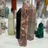 Pink tourmaline tower 461g shown alongside other crystal towers for scale
