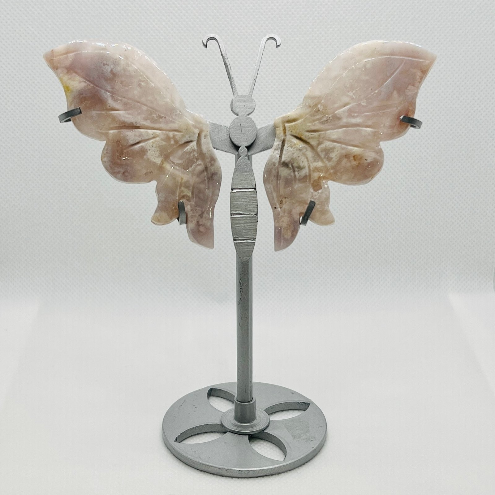 Pink Amethyst Butterfly Wings on Stand 12cm 1 Pink amethyst butterfly wings on a metal stand, 12cm wingspan, carved and polished pale pink stone, Mystic Grove UK