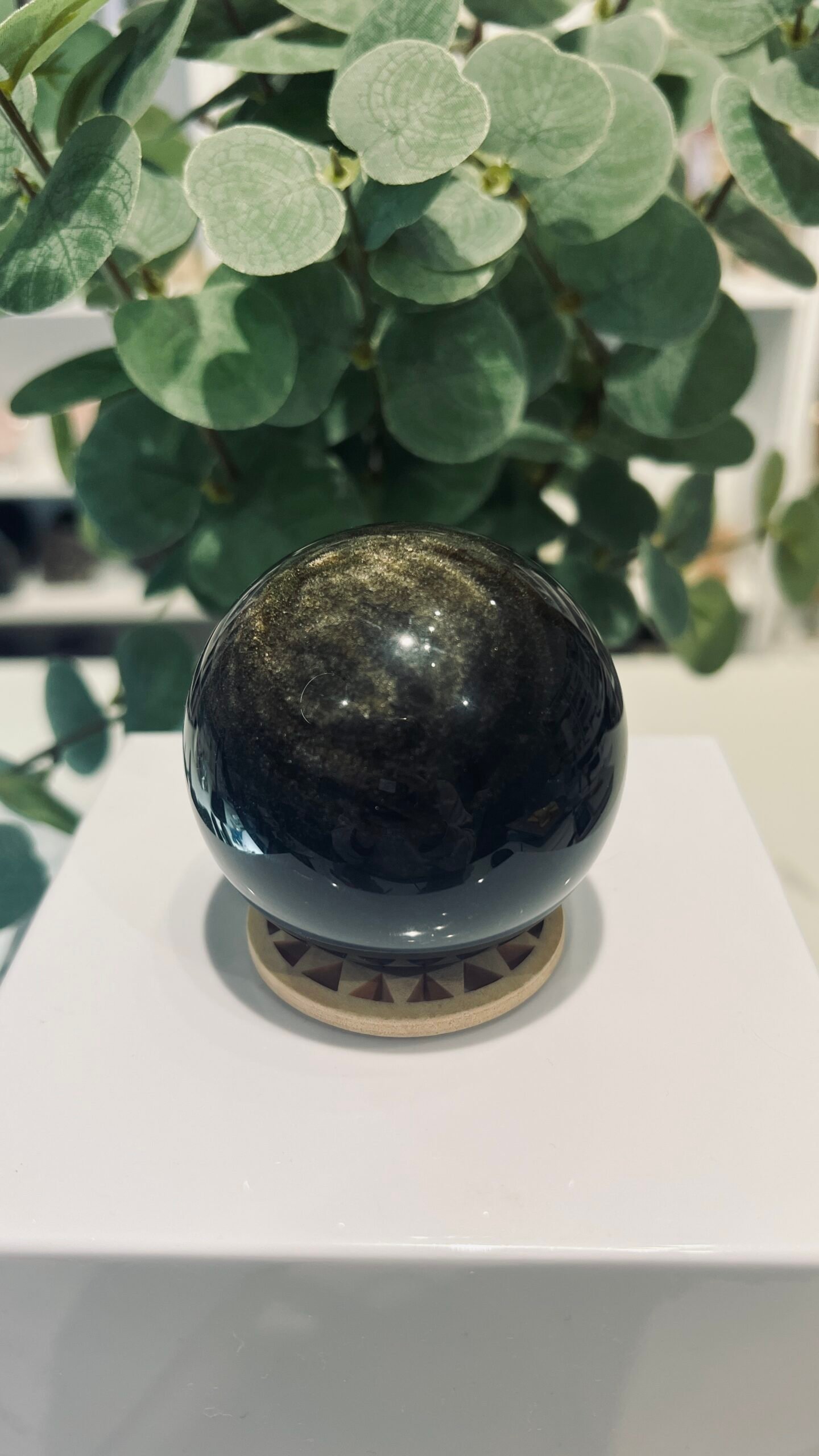 Gold Sheen Obsidian Sphere 63mm 318g 1 Gold sheen obsidian sphere 63mm on a wooden sphere stand, polished black volcanic glass with gold shimmer, Mystic Grove UK