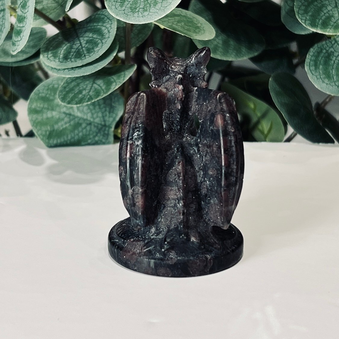 Garnet Dragon Carving 7cm 3 Garnet dragon carving rear view on its round base showing folded wings and tail