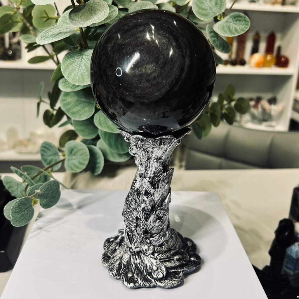 Silver sheen obsidian sphere 90mm on a sculpted silver feather stand, Mystic Grove UK
