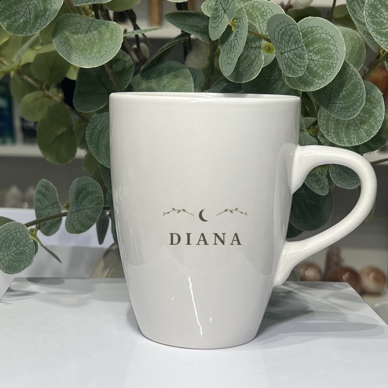 Diana Goddess Mug 13oz Diana goddess mug 13oz, name side with crescent moon and leaf sprigs
