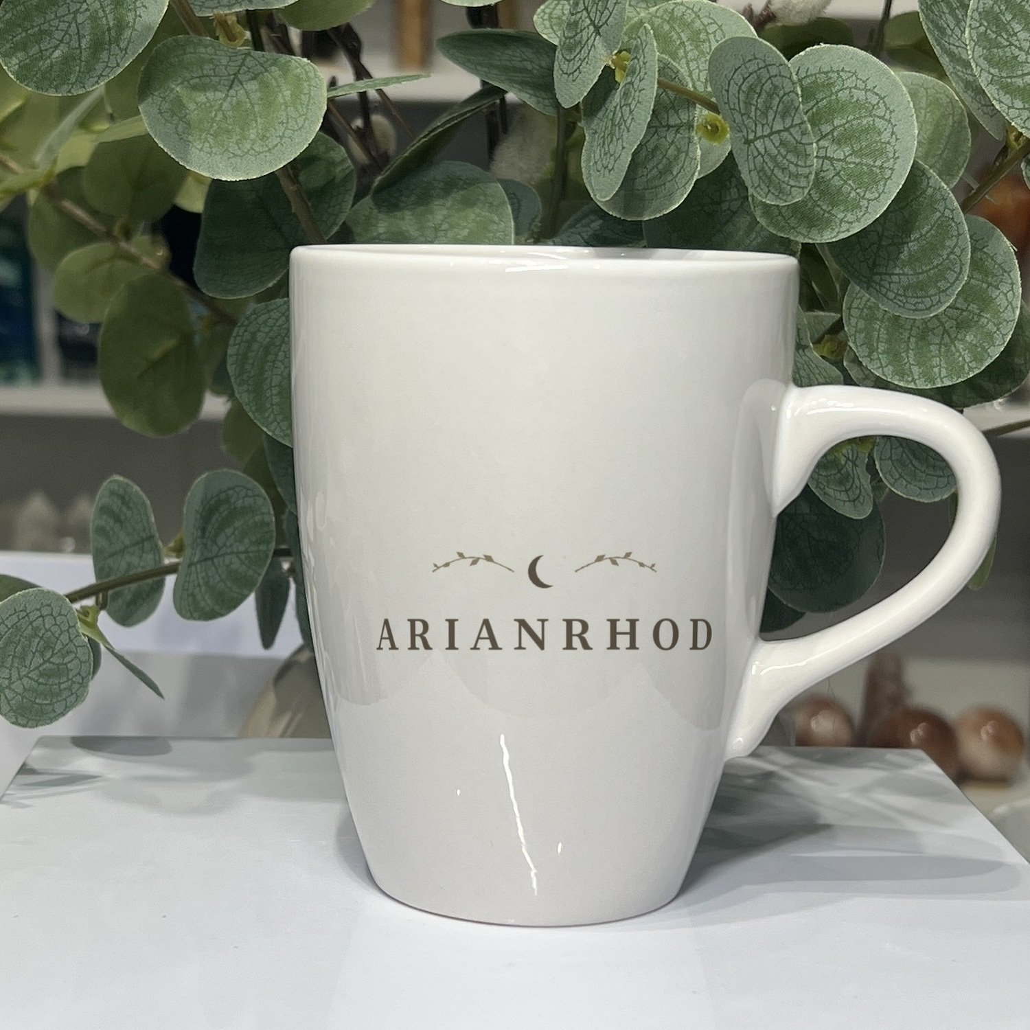 Arianrhod goddess mug 13oz, name side with crescent moon and leaf sprigs