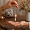 Rose quartz merkaba pendulum with green aventurine point in copper view 3