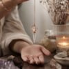 Clear quartz merkaba pendulum with spinning copper star view 3