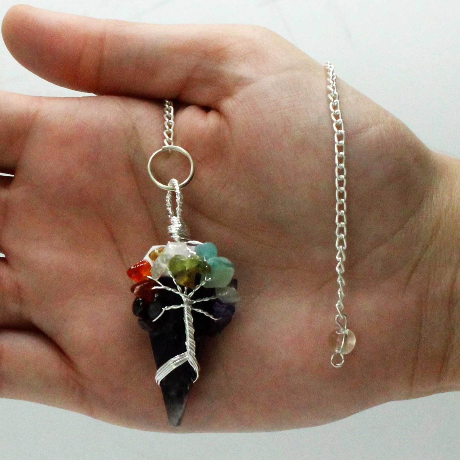 Amethyst chakra pendulum wrapped with seven chakra stones view 2