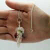 Rose Quartz chakra pendulum wrapped with seven chakra stones view 2