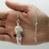 Clear Quartz chakra pendulum wrapped with seven chakra stones view 2