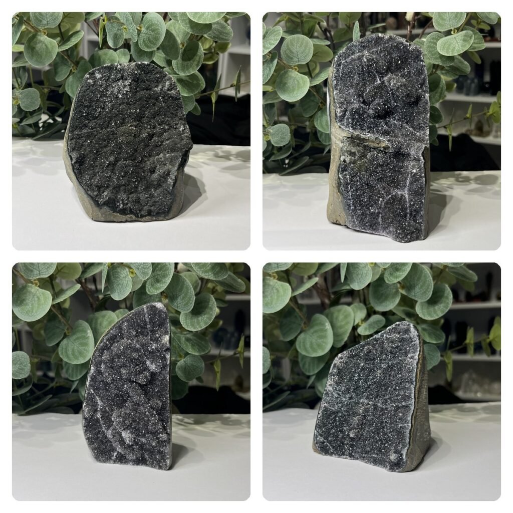 Black amethyst cut base geodes, a group of four dark galaxy amethyst pieces
