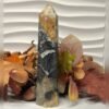 Black ocean jasper tower D Black ocean jasper tower D, black with orange and ochre, polished tower