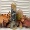 Black ocean jasper tower D Black ocean jasper tower D, black with orange and ochre, polished tower