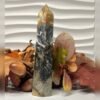 Black ocean jasper tower D Black ocean jasper tower D, black with orange and ochre, polished tower