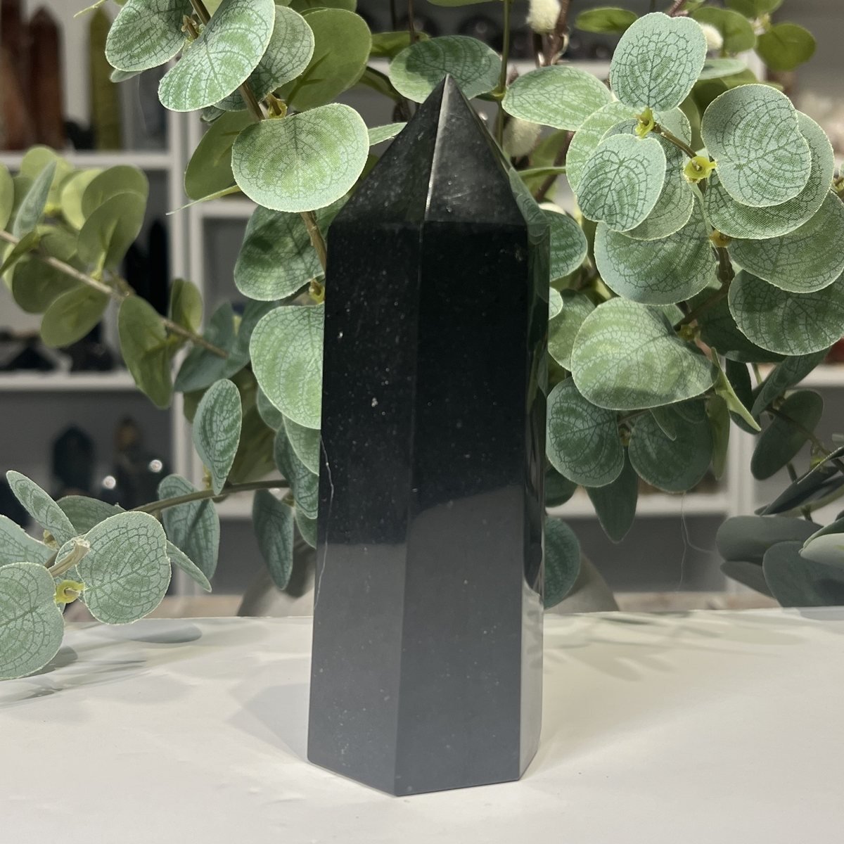 Black Tourmaline Tower 14cm to 17cm Black tourmaline tower close view of the polished faces and soft sheen