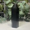 Black Tourmaline Tower 14cm to 17cm Black tourmaline tower side view showing a fine pale line through the stone