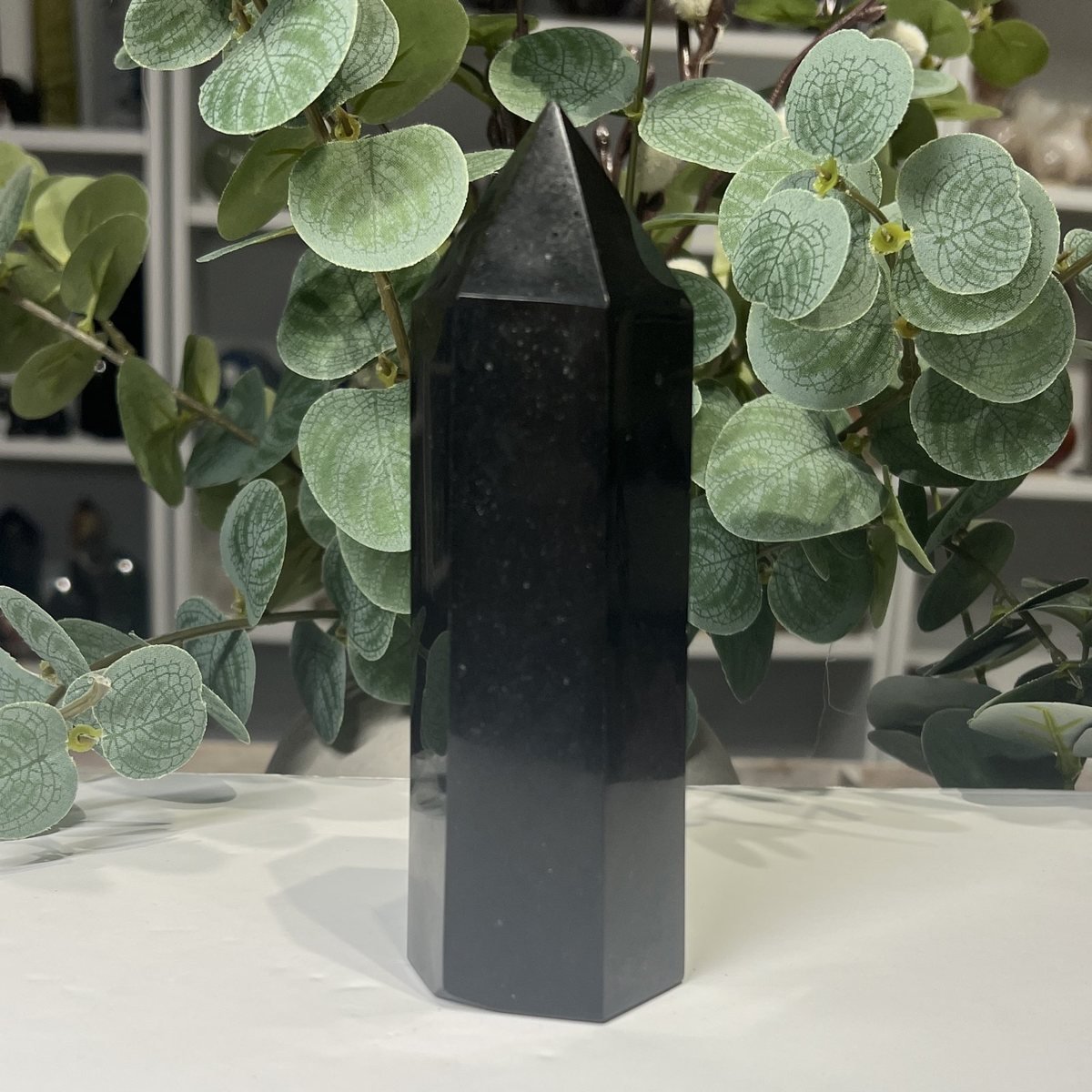 Black Tourmaline Tower 14cm to 17cm Black tourmaline tower side view showing a fine pale line through the stone