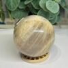 blue flash moonstone sphere 7cm 4 Blue flash moonstone sphere 7cm side view with blue shimmer near the top