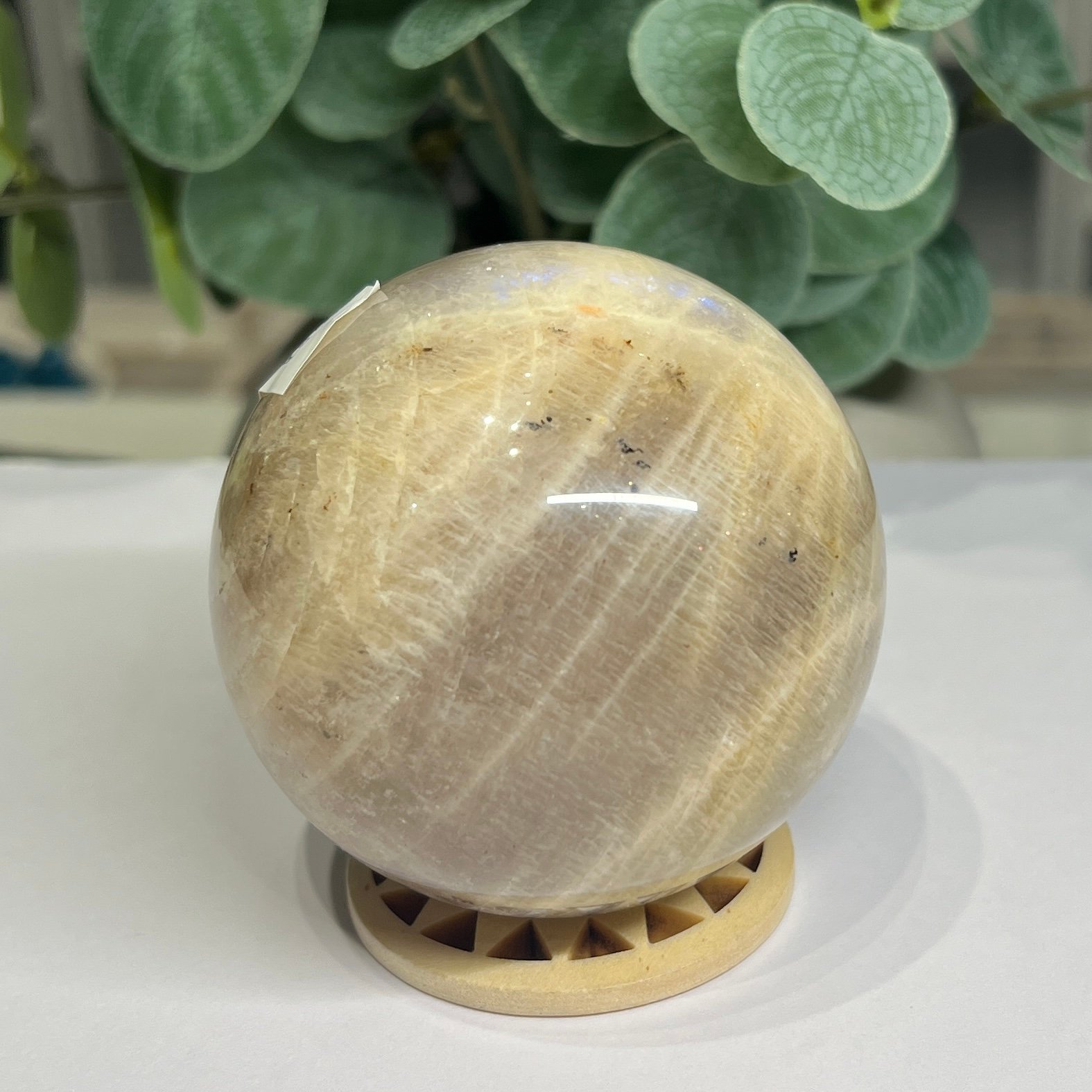 blue flash moonstone sphere 7cm 4 Blue flash moonstone sphere 7cm side view with blue shimmer near the top