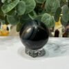 Blue tigers eye sphere 60mm on a clear stand