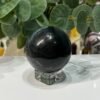 Blue tigers eye sphere on its stand