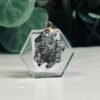 Campo del Cielo meteorite pendant B Campo del Cielo meteorite pendant set in a clear hexagon, piece B