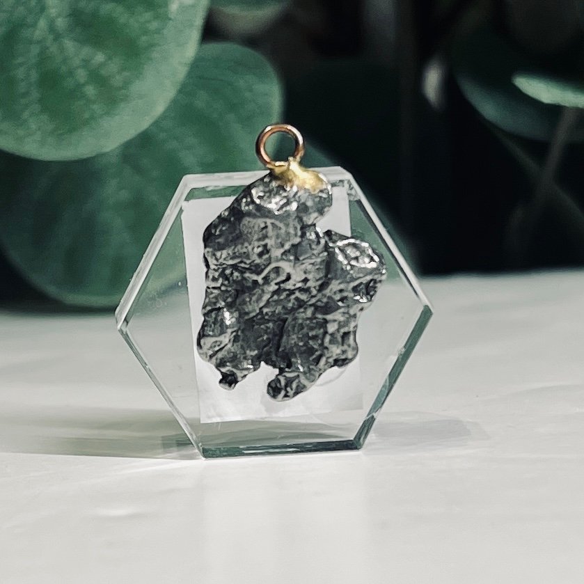 Campo del Cielo meteorite pendant B Campo del Cielo meteorite pendant set in a clear hexagon, piece B