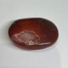carnelian druzy palm stone a Carnelian druzy palm stone A, deep red orange with a sparkling druzy pocket
