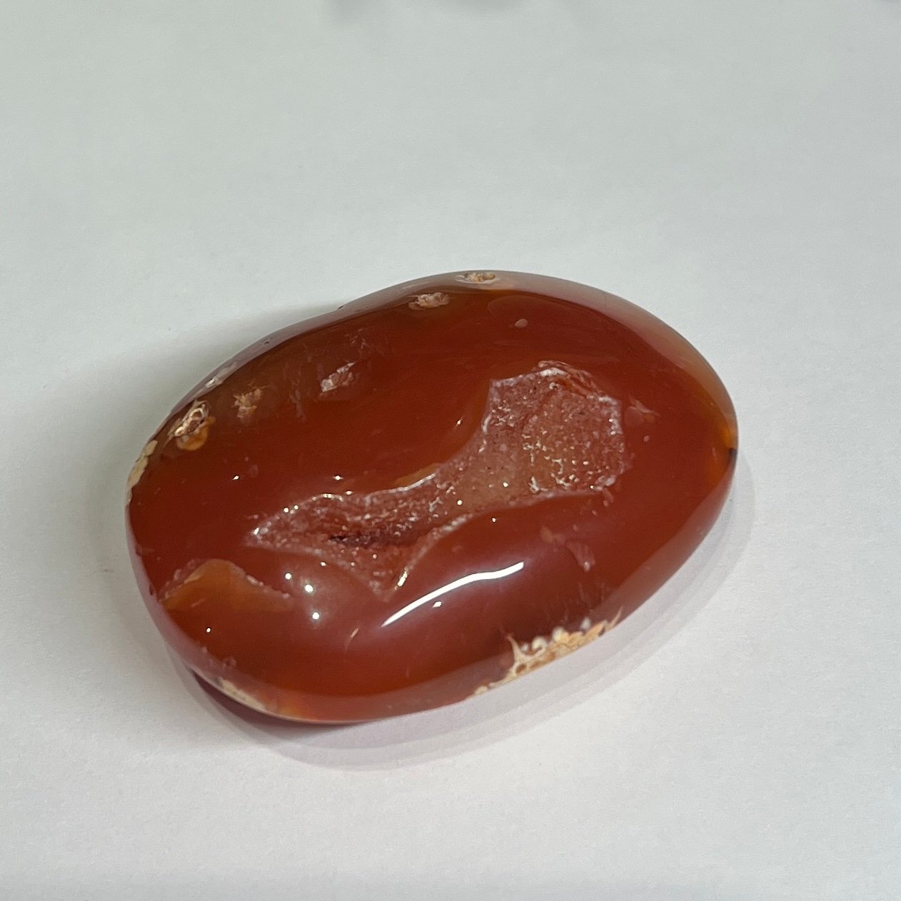 carnelian druzy palm stone b Carnelian druzy palm stone B, warm orange with a long druzy channel