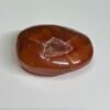 carnelian druzy palm stone c Carnelian druzy palm stone C, amber orange with a shield shaped druzy pocket