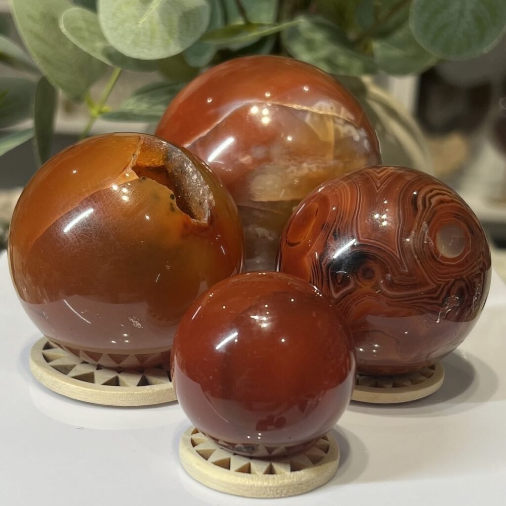 Home 2026 37 Carnelian spheres, a group of polished pieces together