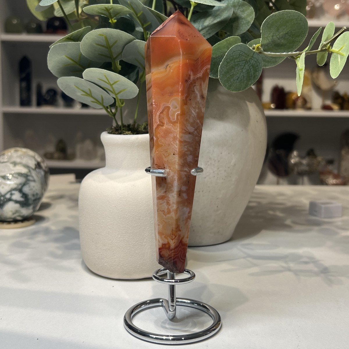 Carnelian Wand Carnelian wand A, 16cm, orange and russet with white banding, on a silver stand