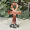 Crystal Ankh on Stand 13cm Fire quartz crystal ankh 13cm on a silver stand, red and white swirls