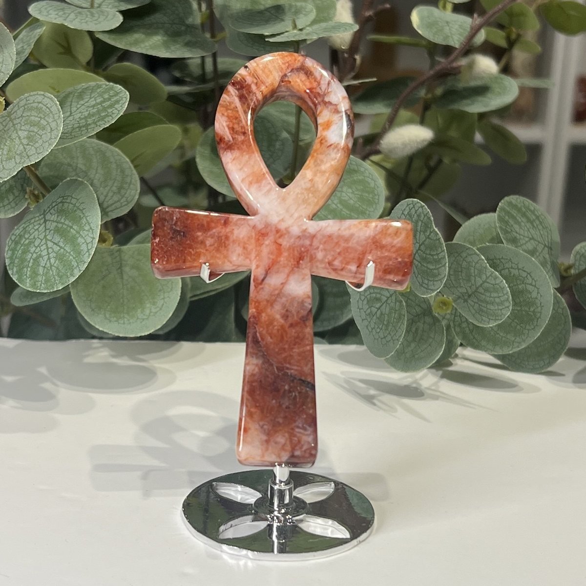 Crystal Ankh on Stand 13cm Fire quartz crystal ankh 13cm on a silver stand, red and white swirls