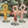 Crystal Ankh on Stand 13cm Crystal ankh carvings 13cm on silver stands in golden healer, fire quartz and rose quartz, Mystic Grove UK