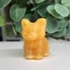 crystal cat carving orange calcite Orange calcite crystal cat carving 6cm, warm tangerine with banding