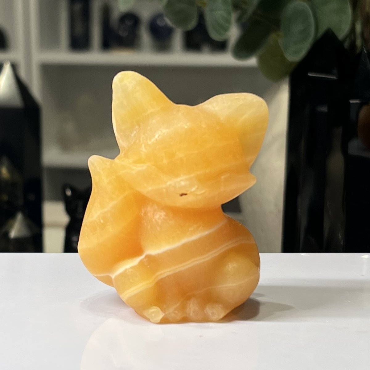 Orange Calcite fox carving 6cm Orange Calcite fox carving 6cm, carved and polished sitting crystal fox