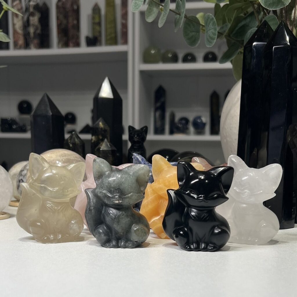 Crystal fox carvings 6cm, a group of carved and polished crystal foxes