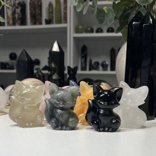 Home 2026 11 Crystal fox carvings 6cm, a group of carved and polished crystal foxes