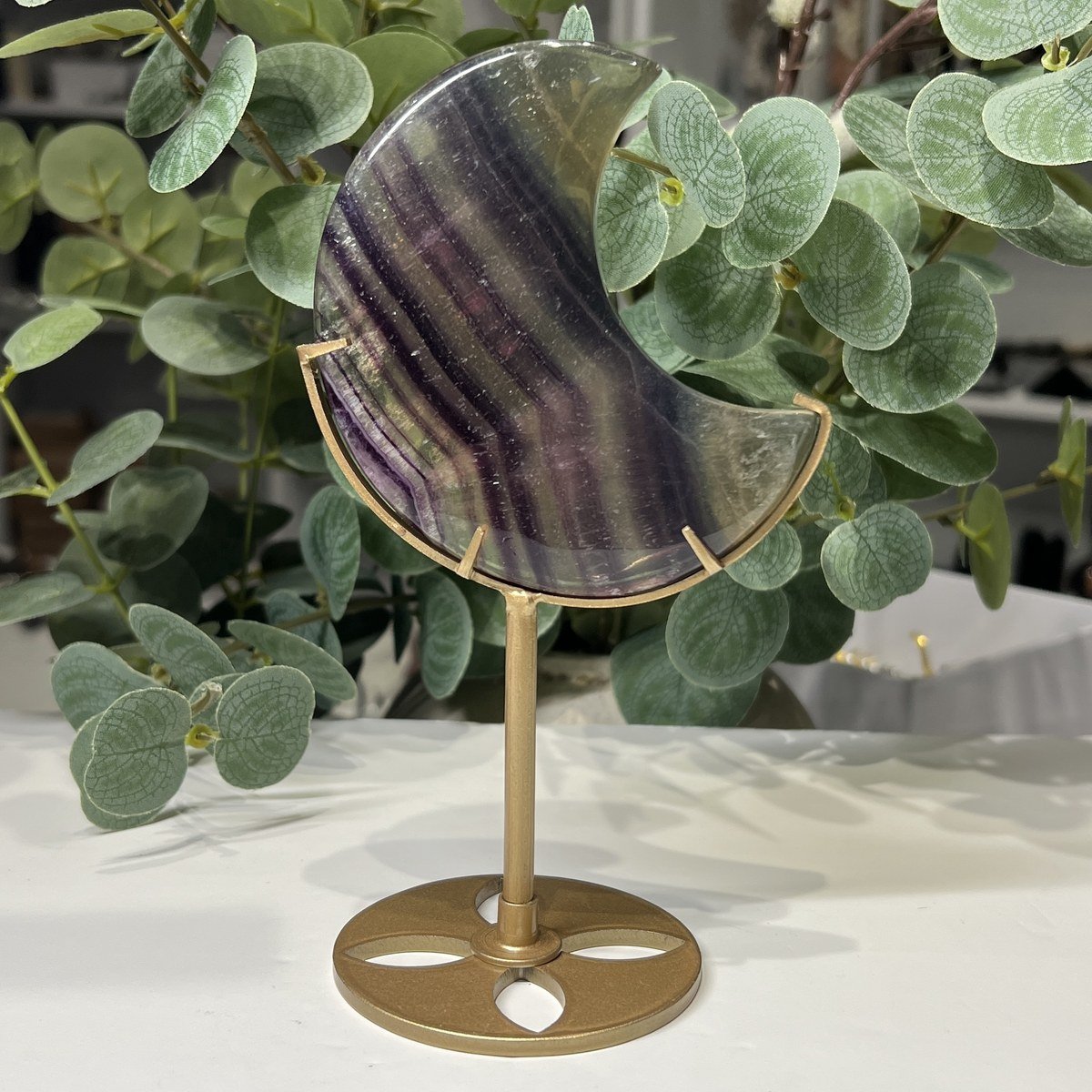 Rainbow fluorite crystal moon D on a gold stand, 10cm Rainbow fluorite crystal moon D on a gold stand, 10cm