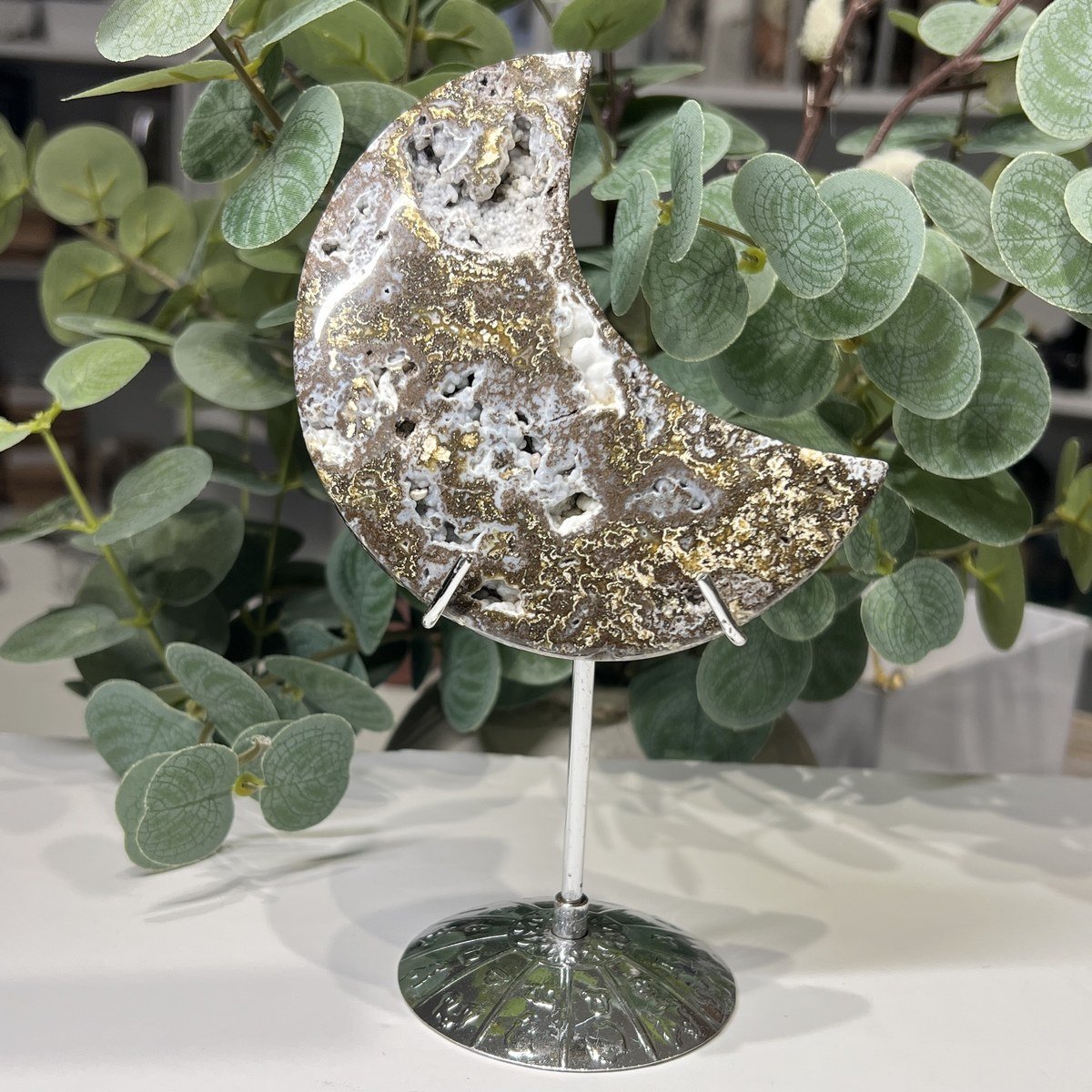 Money agate crystal moon G on a silver stand, 10cm Money agate crystal moon G on a silver stand, 10cm