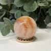 Hematoid quartz sphere E, 63mm, soft peach and orange fire quartz