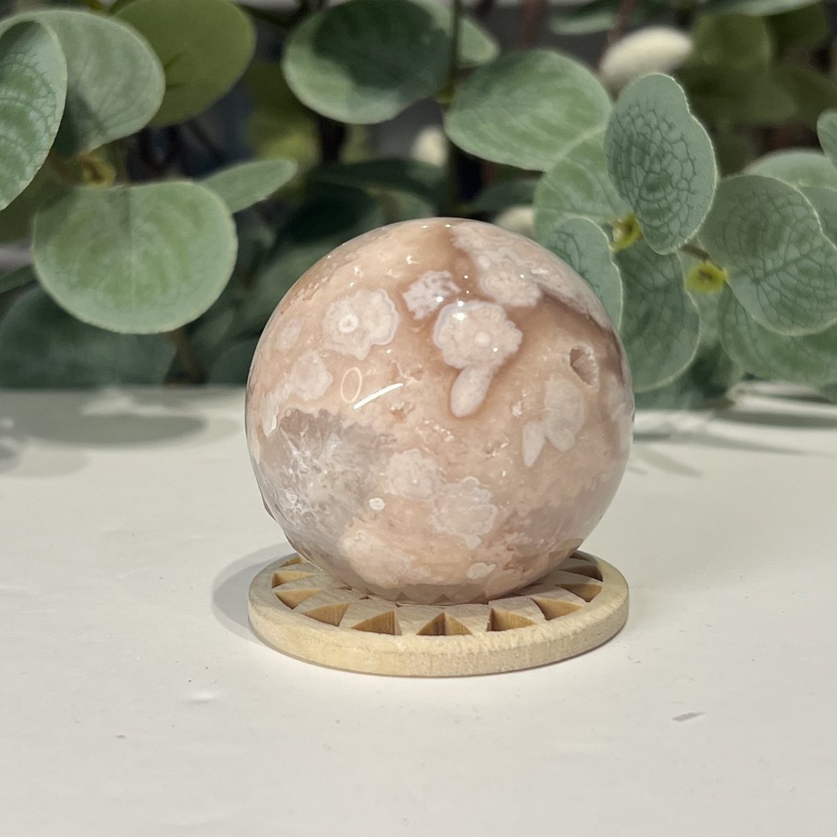 Flower Agate Sphere 49mm Flower agate sphere close view of the white and blush blossom shapes