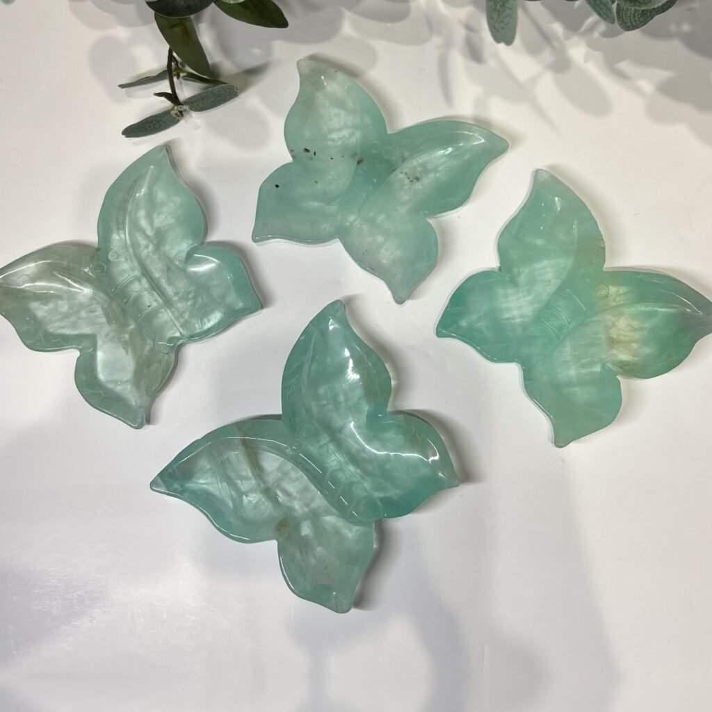 Four green fluorite butterfly trinket dishes