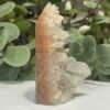Hematoid Quartz Cluster 10cm Raw hematoid quartz cluster 10cm standing upright, clear quartz points over a rust red hematite base, Mystic Grove UK