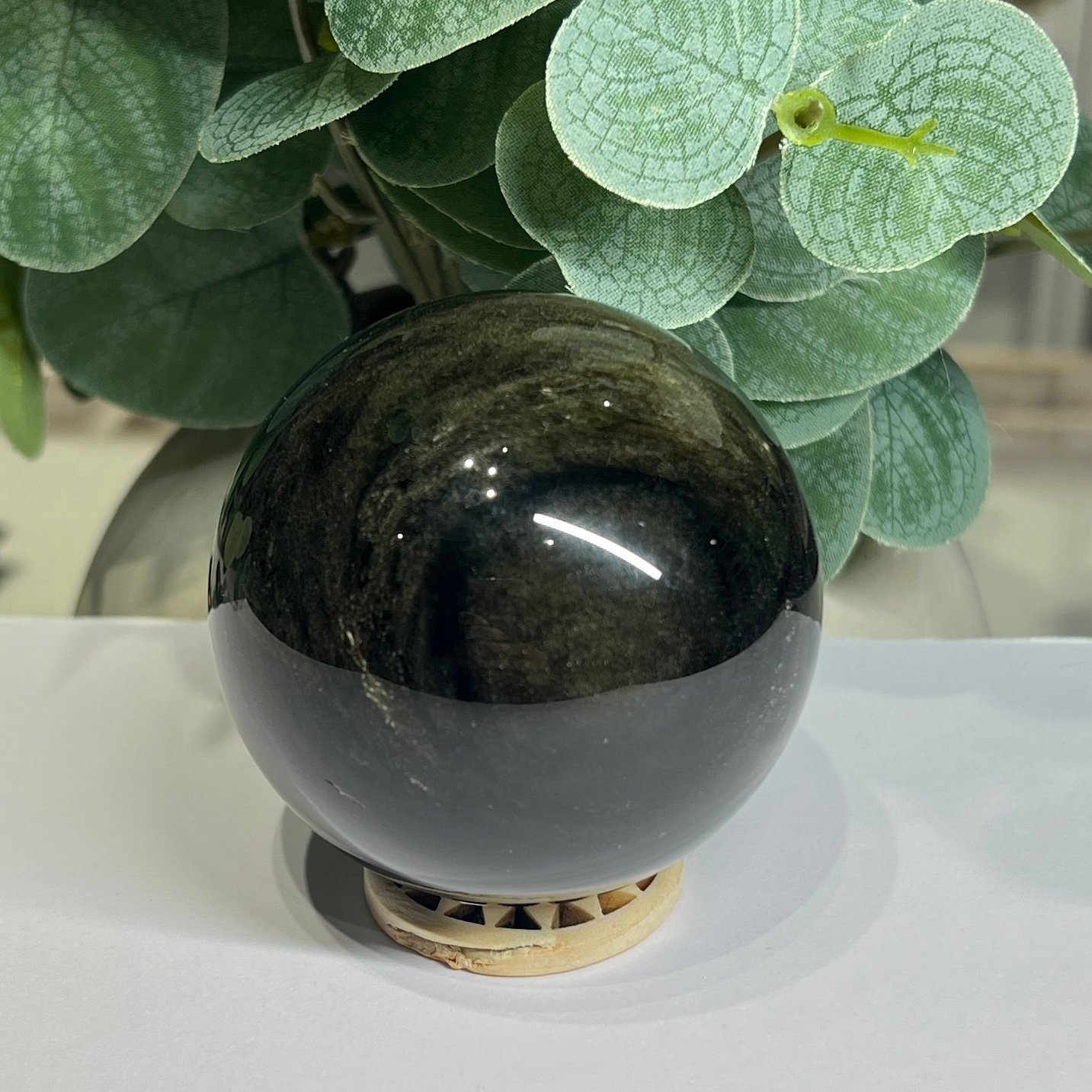 Gold sheen obsidian sphere C, 62mm, with deep bands of golden sheen Gold sheen obsidian sphere C, 62mm, with deep bands of golden sheen