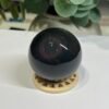 Rainbow obsidian sphere 53mm with a red and purple bullseye ring Rainbow obsidian sphere 53mm with a red and purple bullseye ring