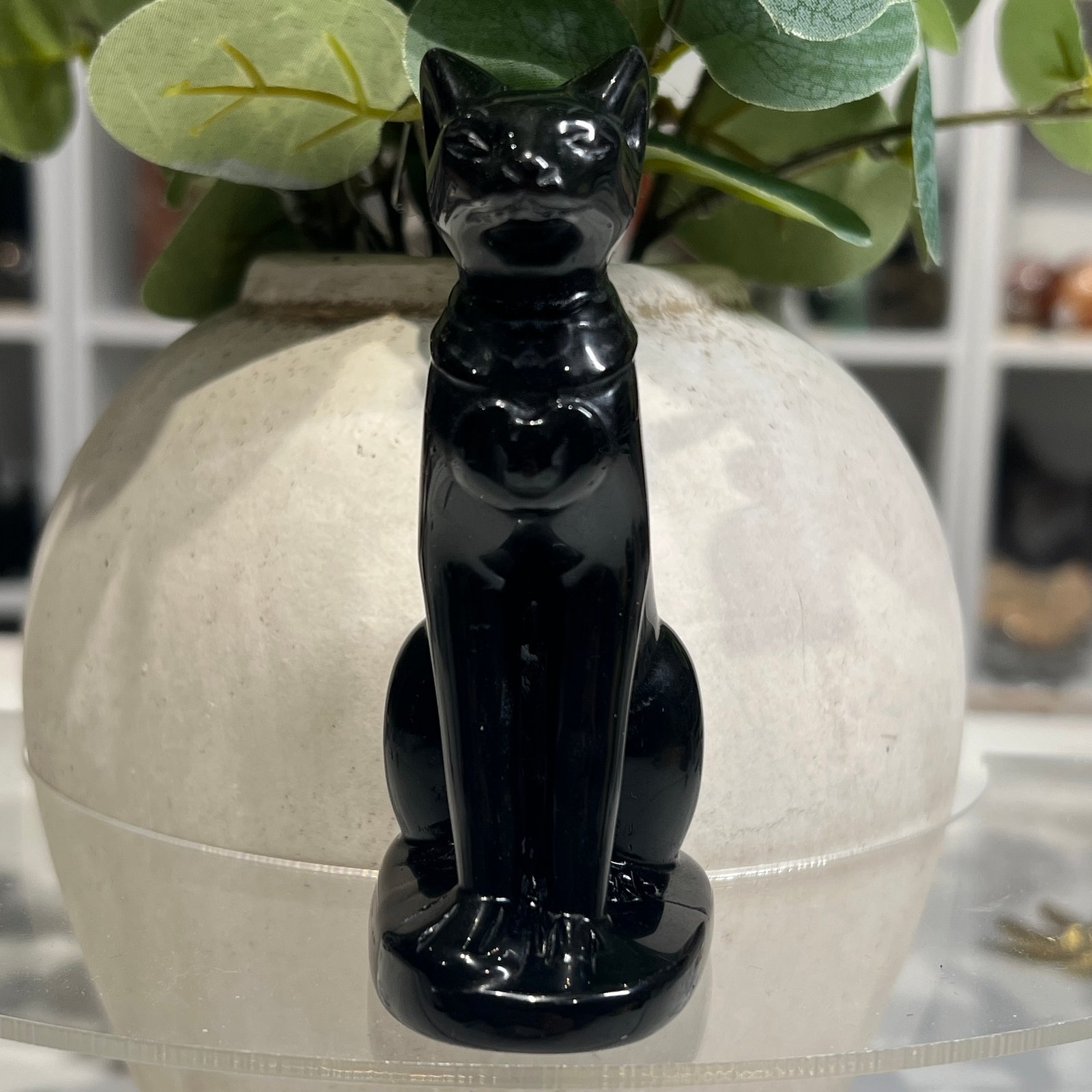 Black obsidian Bastet statue 10cm, Egyptian cat goddess carving, front view Black obsidian Bastet statue 10cm, Egyptian cat goddess carving, front view